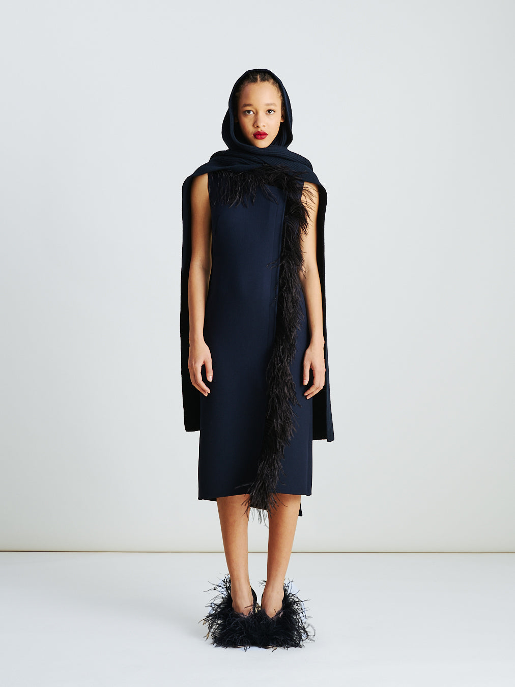 Akris asymmetrical midi dress with feather-trim in navy/black – wool double-face fabric, sleeveless with round neck, trapeze panel and feather detail for modern elegance.