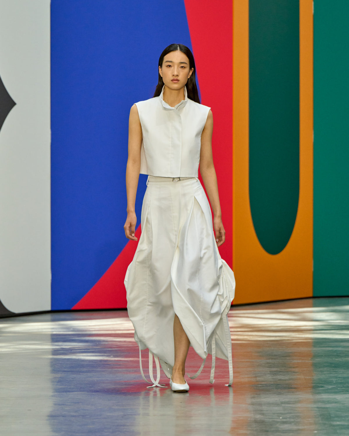 A look from Akris Spring/Summer 2026, blending art and fashion with Swiss luxury design, couture craftsmanship, and timeless elegance inspired by Leon Polk Smith