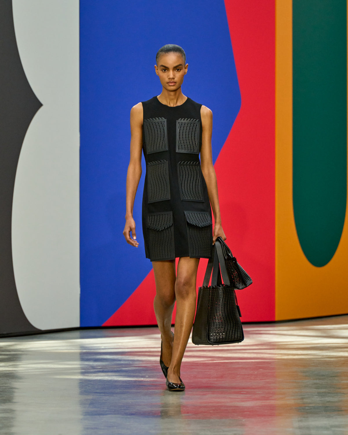 A look from Akris Spring/Summer 2026, blending art and fashion with Swiss luxury design, couture craftsmanship, and timeless elegance inspired by Leon Polk Smith