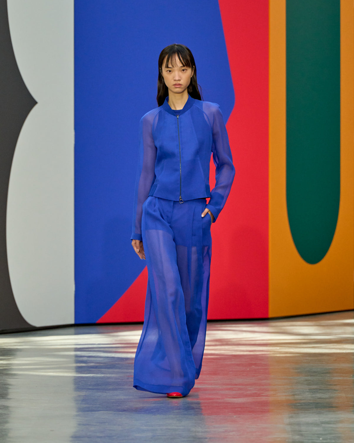 A look from Akris Spring/Summer 2026, blending art and fashion with Swiss luxury design, couture craftsmanship, and timeless elegance inspired by Leon Polk Smith