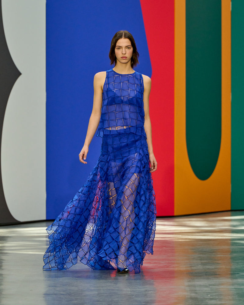 A look from Akris Spring/Summer 2026, blending art and fashion with Swiss luxury design, couture craftsmanship, and timeless elegance inspired by Leon Polk Smith