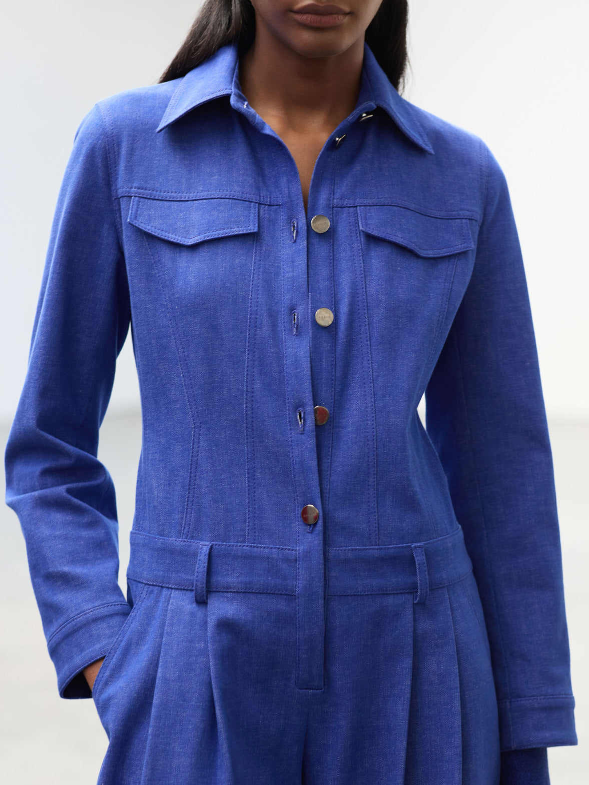 Embrace effortless travel style with the Akris Spring collection, highlighting a chic, lightweight jumpsuit perfect for a luxurious weekend getaway. Combining ultimate comfort with a sharp, minimalist silhouette, this versatile piece is designed for the modern woman on the move. Experience relaxed elegance and premium Swiss craftsmanship.