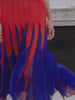 Close-up of an Akris pleated silk georgette dress in vibrant blue and red, showcasing a fluid, sculptural movement inspired by Leon Polk Smith's abstract art.