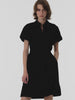 Akris punto Spring video showcasing a black mini dress with an animated polka dot effect. The focus is on the magical appearance of white dots on the black fabric, highlighting the brand’s signature playful and graphic aesthetic.